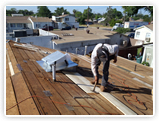 man installing roof 